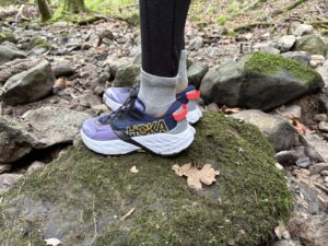 Side profile of a pair of Hoka shoes.